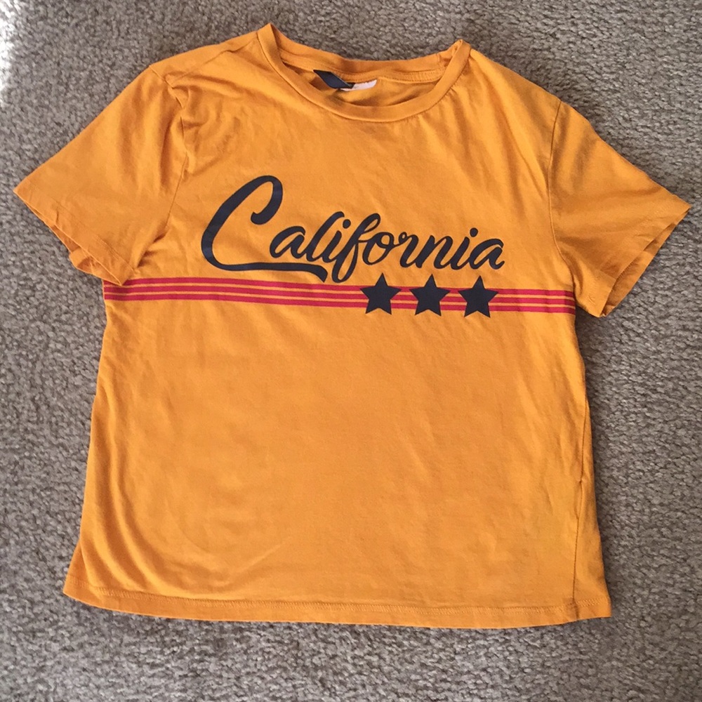 A mustard yellow t-shirt.